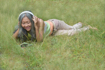 woman is relaxing in grass