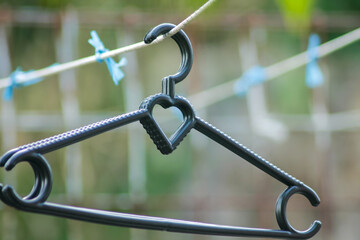 black plastic clothes hanger	
