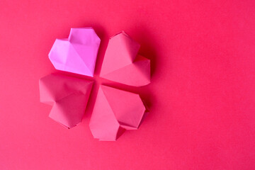 Heart shape paper decoration isolated on pink background with copy space for greeting text, Valentines day and love romance concept background