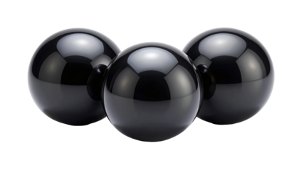 Three glossy, black spheres with reflections against a stark black backdrop