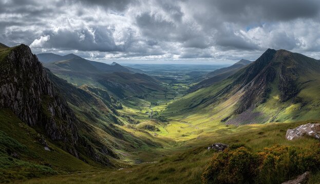 Dramatic mountain valley landscape under a stormy, sunlit sky - Powered by Adobe