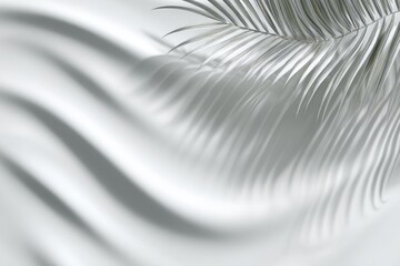 Light and shadow play over flowing fabric and a delicate frond in shades of white