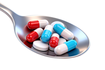 Pills and Tablets on a Metal Spoon for Medication