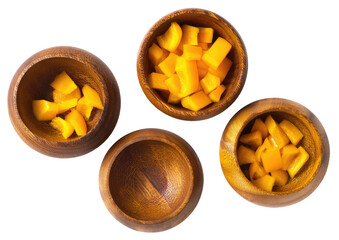 Chopped, ripe yellow fruit in small wooden bowls, top-down view, on black
