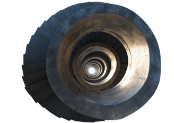 Deep spiral staircase descends into darkness, catching light at the core