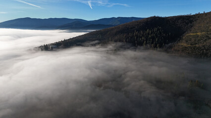 Obraz premium Drone View of Fog In The Mountains