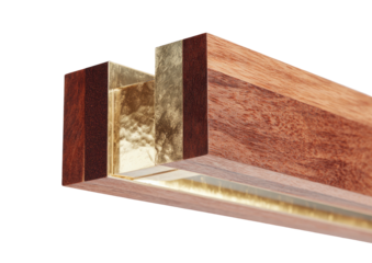 Angled close-up of wood frame with gold leaf accents, against black backdrop