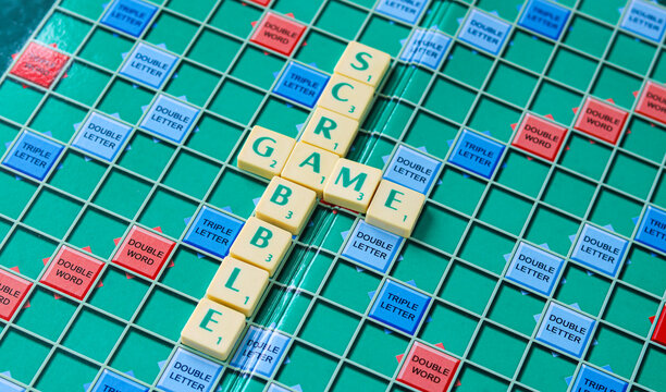 Tangerang, Indonesia - November 13, 2025: Scrabble tiles spelling "Game" and "SCRABBLE" on a game board.