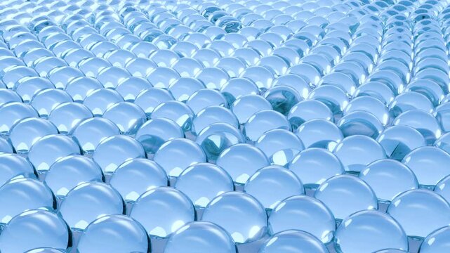 3D animation of a blue wave formed by spherical cells, abstractly visualizing hydration and skin renewal for cosmetic and skincare backgrounds.