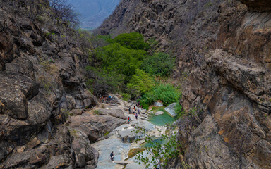 Obraz premium Jagueyes de Mayascon, a natural oasis with crystal clear pools surrounded by mountains in Lambayeque, Peru