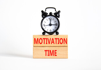 Motivation Time symbol. Concept word Motivation Time on wooden blocks. Beautiful white background with alarm clock. Business and Motivation Time concept. Copy space