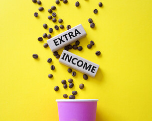 Extra Income symbol. Concept words Extra Income on beautiful wooden picture frame. Beautiful yellow background with coffee cup and coffee beans. Business and Extra Income concept. Copy space.