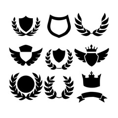 Fototapeta premium Collection of vector heraldic elements including laurel wreaths shields wings and ribbons perfect for creating logos or designs