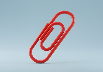 Red paperclip isolated on light gray background