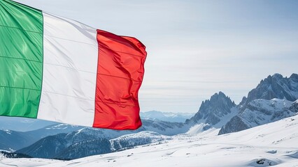 Italian flag waving on snowy mountain peak with breathtaking view of rugged landscape and majestic snow capped