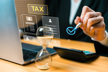 Tax deadline and compliance management concept with hourglass, digital checklist, and business professional using laptop. Modern tax filing, accounting, and fintech workflow.