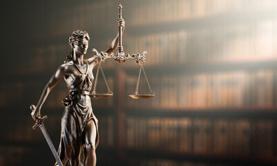 Legal Concept: Themis is the goddess of justice and the judge's gavel hammer as a symbol of law and order on the background of books