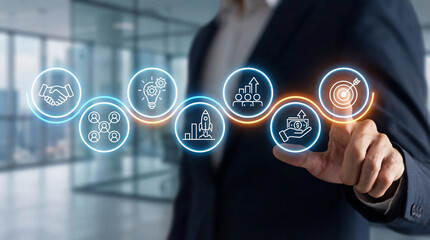 Businessman touching virtual interface showing startup growth and business lifecycle icons