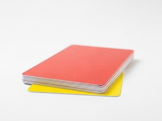 Fototapeta premium Red and yellow plastic cards on white background