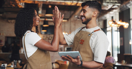 Waiter, high five and people with tablet in coffee shop for barista training, counting stock or inventory management. Hospitality industry, excited and digital tech for cafe system or order success