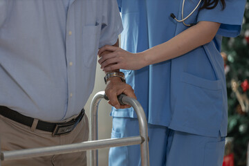 Nurse assisting elderly man with walker during rehabilitation therapy. Concept of healthcare support, senior care, physical therapy and elderly mobility aid in hospital or home care environment.