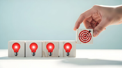 Hand placing a target on a light bulb in a row of illuminated red light bulbs