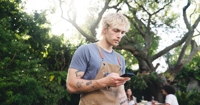 Barbecue, phone and search with man outdoor for online recipe, party event and social gathering. Digital grill tutorial, bbq cooking direction and summer vacation with person and tech in nature