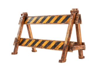 Weathered wooden barrier with black/yellow diagonal hazard stripes on bars