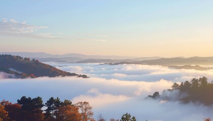 Fototapeta premium Serene landscape featuring misty valleys and colorful autumn foliage under a clear sky