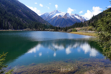 Dagu lake at Dagu Glacier National Park, Sichuan China the "youngest," lowest-altitude, and closest glacier to major city in the world with stunning views of snow-capped mountains and turquoise lake