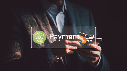 Businessman holding credit card and smartphone making secure online payment with digital payment and shopping icons.