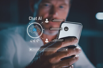 Man using smartphone with AI chat interface, digital assistant concept, artificial intelligence communication and mobile technology at night.
