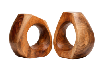 Pair of smooth light brown wooden teardrop shapes with central circular holes abstract