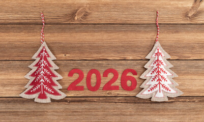 shape of pine tree christmas decoration with 2026 on wooden background