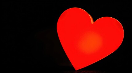 adore. A red heart symbol on a black background, an emotional expression with deep contrast. wellbeing guides, coaching materials, designed for mental health education and mindfulness programs.