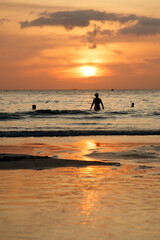 Fototapeta premium A man is swimming in the ocean