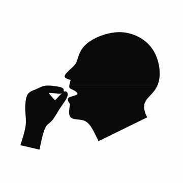 Pill icon. A head with an open mouth and a hand holding a pill. Isolated on a white background. Vector silhouette.