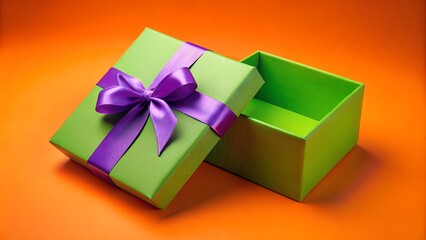Green colored opened cardboard box placed on bright orange surface near gift bow against violet background