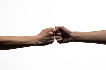 Two human fists meet in a central fist bump gesture, symbolizing solidarity, agreement, or encouragement. Clean white background with ample copy space
