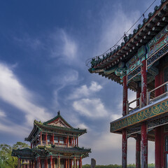 Obraz premium Ancient Chinese Palace Architecture with Ornate Roofs and Summer Sky
