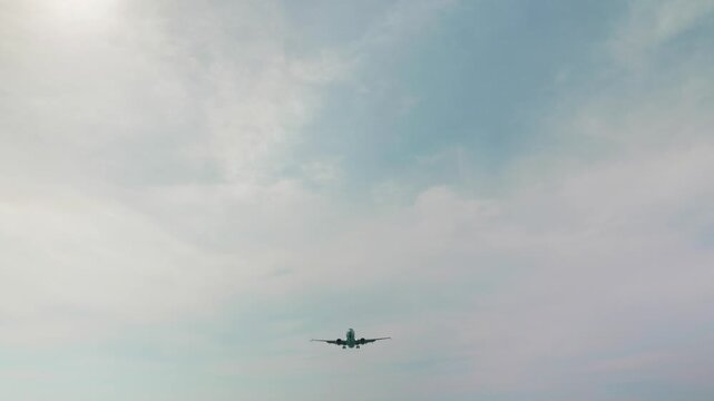 A commercial plane is landing at the airport.
