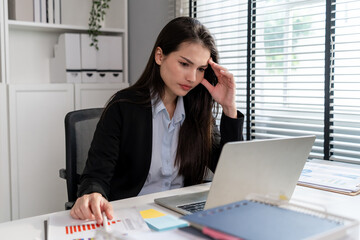 Frustrated Mixed race businesswoman overwork late in office workplace. 