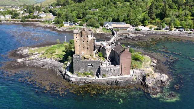 Drone shot of Eilean Donan Castle near Kyle of Lochalsh, Scotland, UK