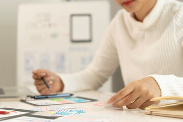 Creative web designer planning UI application and developing digital template