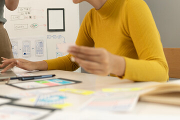 Creative web designer planning UI application and developing digital template