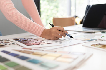 Creative web designer planning UI application and developing digital template