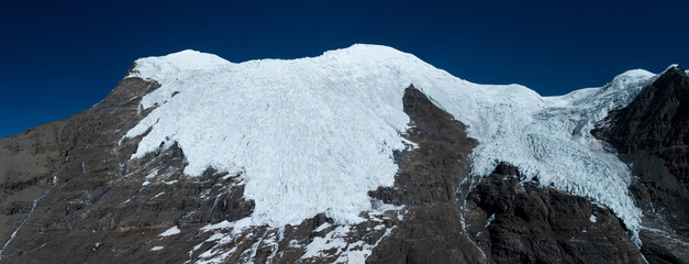 Aerial view of high altitude glacier and snow capped mountain in Tibet, China