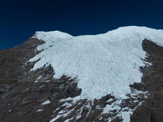 Aerial view of high altitude glacier and snow capped mountain in Tibet, China
