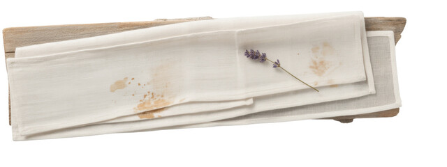 stained napkins with lavender on wooden surface.