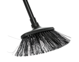 Black bristle broom head on black handle against black bg